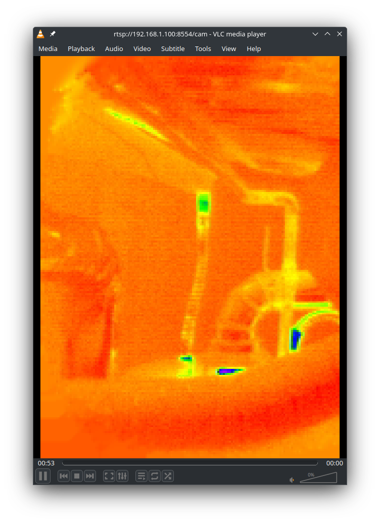 Thermal image showing the top of a water heater. It is mostly orange